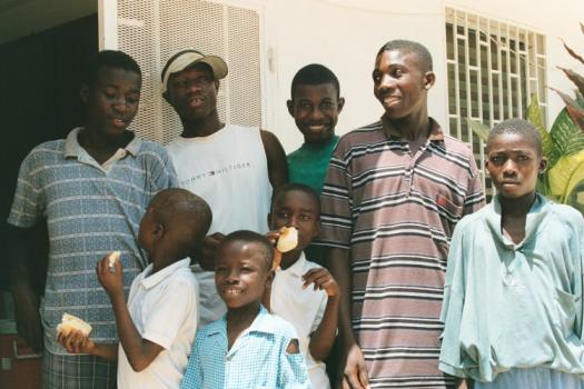 Guys at the orphanage, some with snacks
